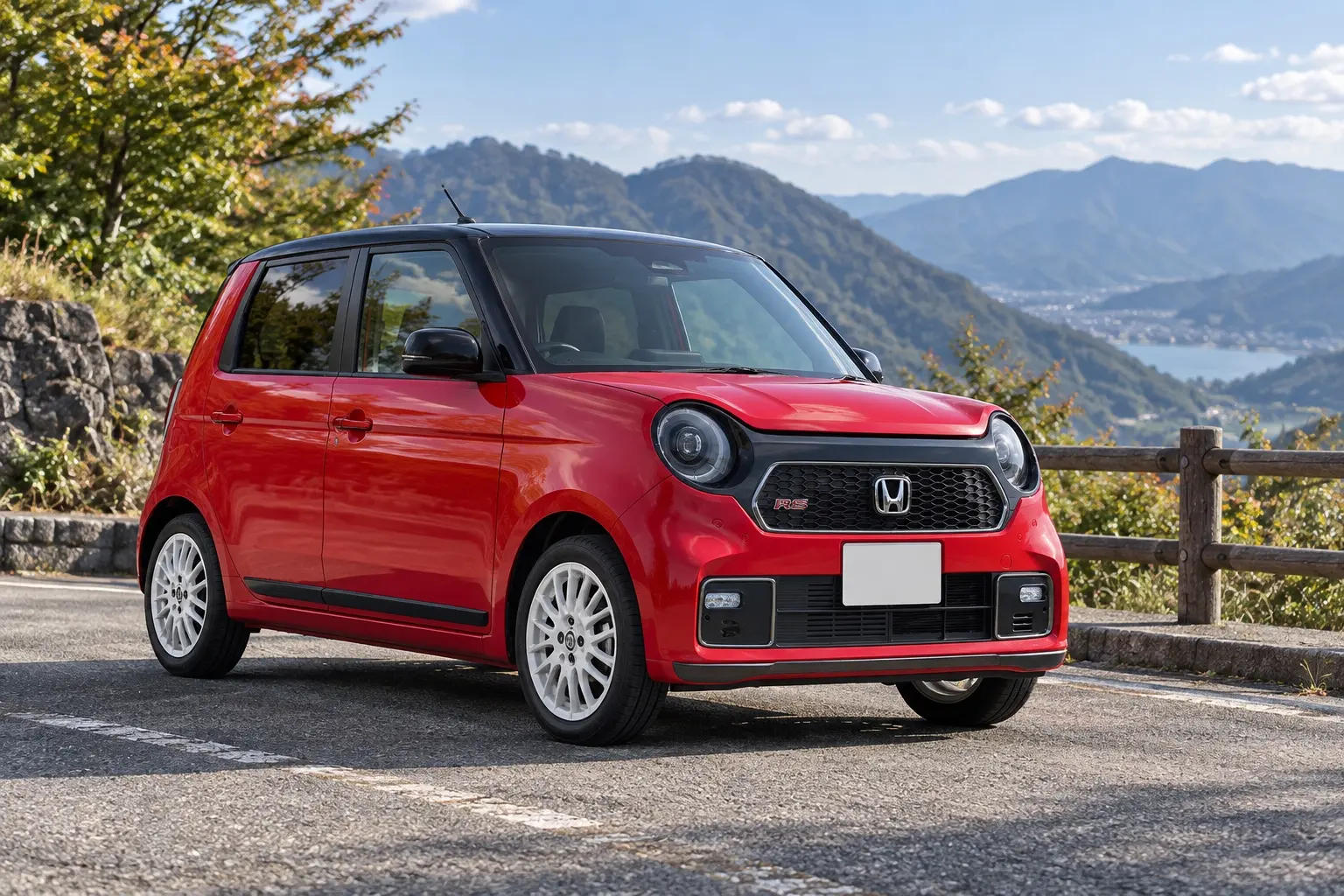 ホンダ N-ONE RSの斜め前からの外観。丸いヘッドライト、低く構えたボディ、白い15インチアルミホイール。ボディカラーはフレームレッド&ブラックの2トーン。峠道の駐車スペースに停まっている