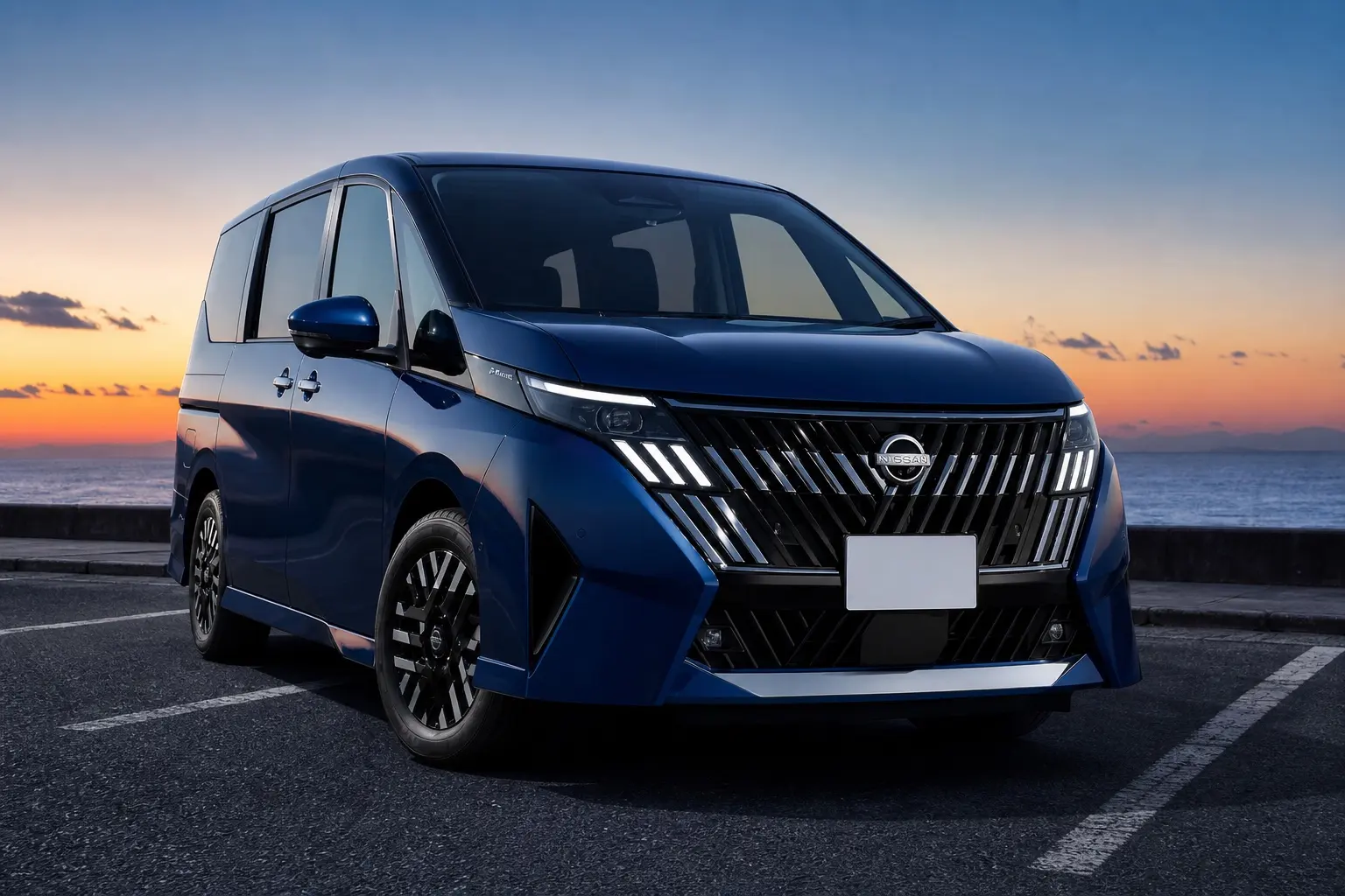 日産セレナ（C28型・2026年モデル）の斜め前からの外観。深いブルー。夕方の海沿いの駐車場